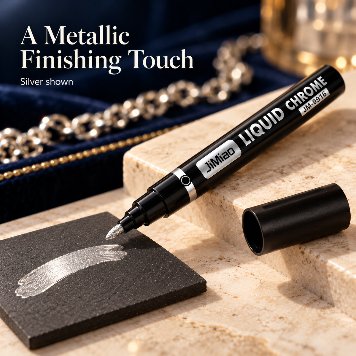 Silver metallic paint marker and an illustrative paint sample